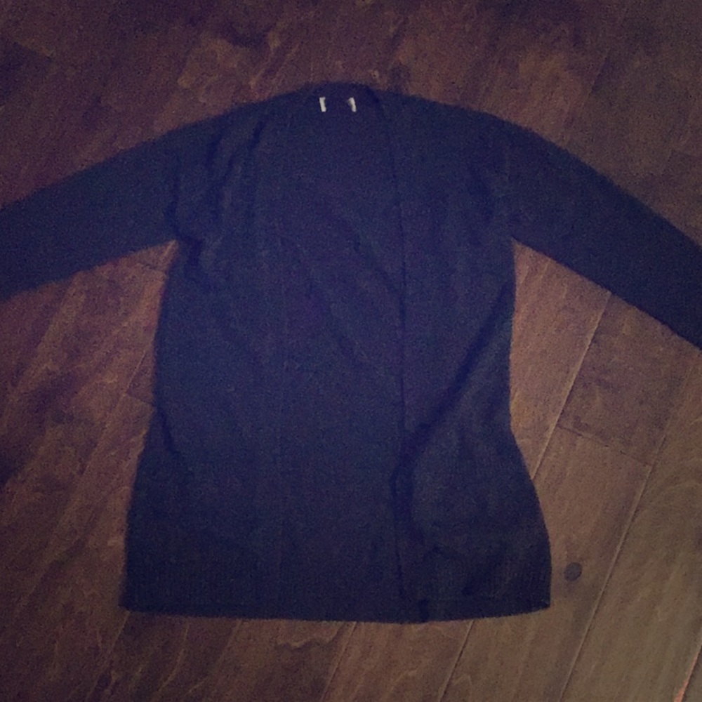 . ° black knit cardigan sweater.